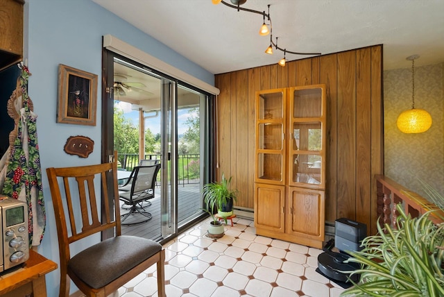 30 Panoramic Dr, Kalispell, MT 59901 - doorway with light flooring, wallpapered walls, track lighting, wooden walls, and baseboard heating