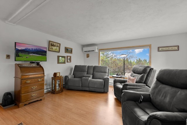 30 Panoramic Dr, Kalispell, MT 59901 - living room featuring light wood-style floors, a wall unit AC, a textured ceiling, and a baseboard heating unit