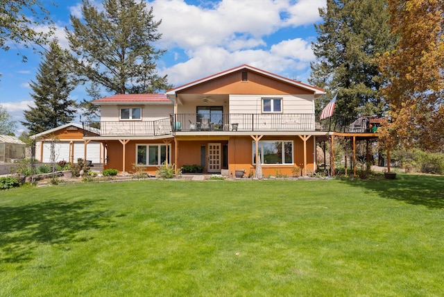 30 Panoramic Dr, Kalispell, MT 59901 - back of house featuring a ceiling fan, a lawn, a deck, a garage, and french doors