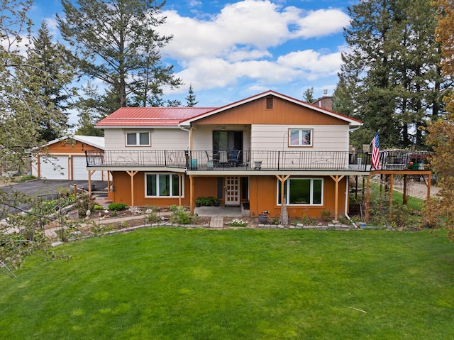 30 Panoramic Dr, Kalispell, MT 59901 - back of house featuring a chimney, a wooden deck, a yard, and a garage