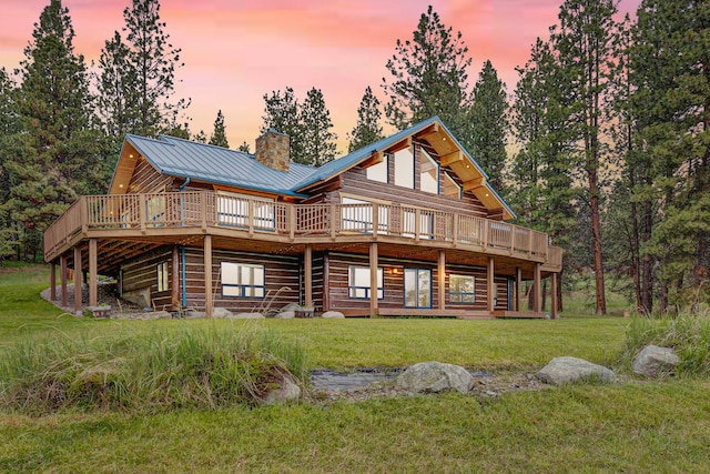 629 Alvista Loop, Hamilton, MT 59840 - back of house featuring a chimney, a deck, a yard, and metal roof