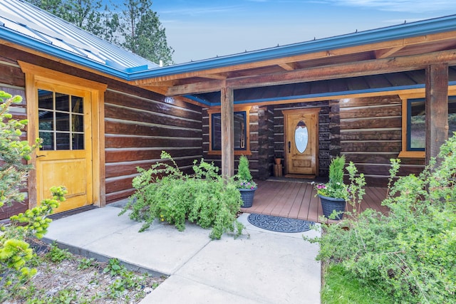 629 Alvista Loop, Hamilton, MT 59840 - entrance to property featuring log exterior, metal roof, a standing seam roof, and covered porch