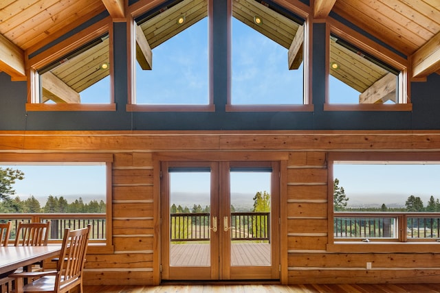 629 Alvista Loop, Hamilton, MT 59840 - entryway with hardwood / wood-style flooring, french doors, high vaulted ceiling, wood walls, and healthy amount of natural light
