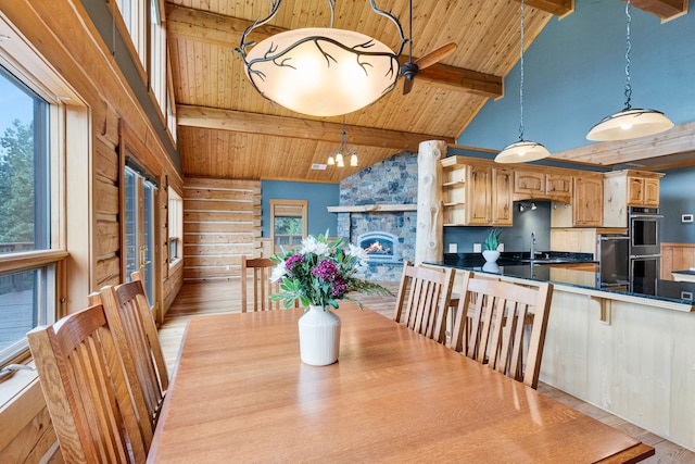 629 Alvista Loop, Hamilton, MT 59840 - dining room with wood ceiling with exposed beams, high vaulted ceiling, a ceiling fan, light wood-type flooring, and wood walls