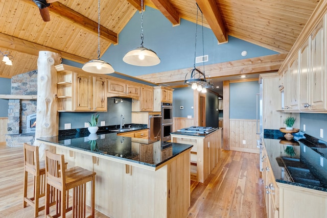 629 Alvista Loop, Hamilton, MT 59840 - kitchen with a sink, light wood-style flooring, wood ceiling with exposed beams, a kitchen island, and wainscoting