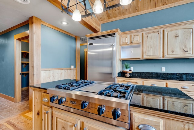 629 Alvista Loop, Hamilton, MT 59840 - kitchen featuring stovetop with downdraft, stainless steel built in refrigerator, light brown cabinets, and dark stone countertops