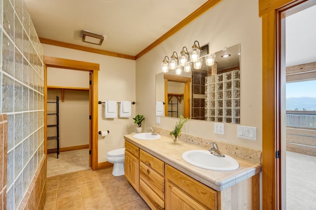 629 Alvista Loop, Hamilton, MT 59840 - bathroom with double vanity, ornamental molding, toilet, tile patterned floors, and baseboards