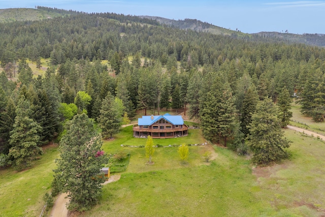 629 Alvista Loop, Hamilton, MT 59840 - view of subject property featuring a heavily wooded area and a mountainous background