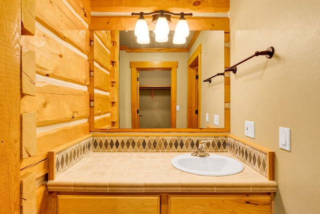 629 Alvista Loop, Hamilton, MT 59840 - bathroom with vanity, backsplash, and a chandelier