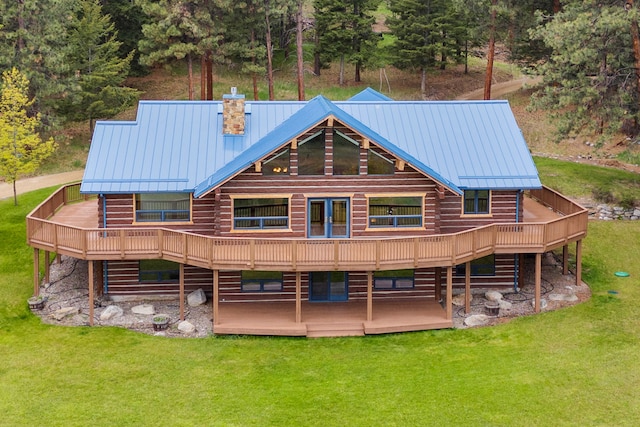 629 Alvista Loop, Hamilton, MT 59840 - rear view of property featuring a deck, a lawn, a chimney, and metal roof