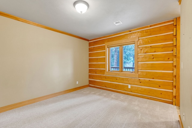 629 Alvista Loop, Hamilton, MT 59840 - carpeted empty room featuring crown molding, baseboards, and wood walls
