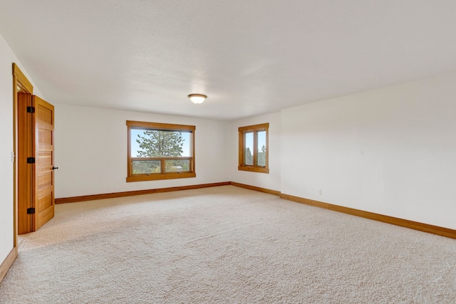 629 Alvista Loop, Hamilton, MT 59840 - spare room featuring baseboards and light colored carpet