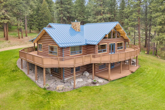 629 Alvista Loop, Hamilton, MT 59840 - back of property featuring a deck, a chimney, and a lawn