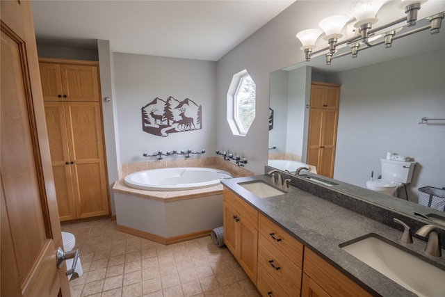 3185 Hubbart Dam Rd, Marion, MT 59925 - bathroom featuring toilet, a bath, and double vanity