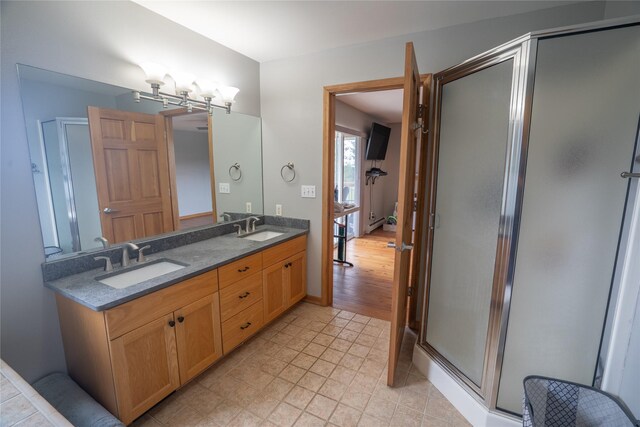 3185 Hubbart Dam Rd, Marion, MT 59925 - bathroom featuring double vanity, a shower stall, and tile patterned floors