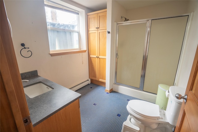3185 Hubbart Dam Rd, Marion, MT 59925 - full bathroom featuring a baseboard radiator, a shower with door, toilet, and vanity