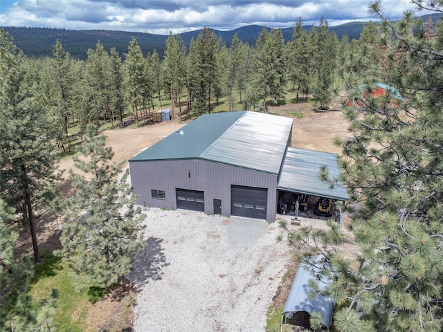 3185 Hubbart Dam Rd, Marion, MT 59925 - view from above of property featuring a mountainous background and a forest