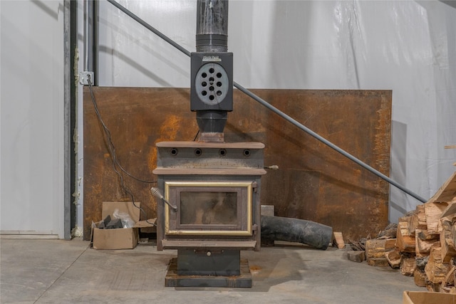 3185 Hubbart Dam Rd, Marion, MT 59925 - detailed view of unfinished concrete floors and a wood stove