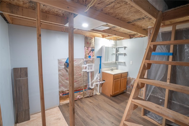 3185 Hubbart Dam Rd, Marion, MT 59925 - finished basement with light wood-type flooring and a sink