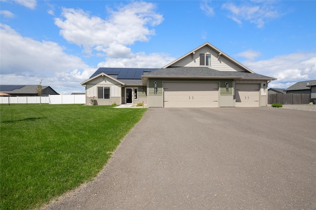 3870 Swan Rd, East Helena, MT 59635 - single story home featuring roof mounted solar panels, board and batten siding, asphalt driveway, an attached garage, and roof with shingles