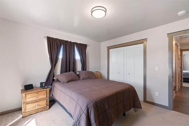 3870 Swan Rd, East Helena, MT 59635 - bedroom featuring light carpet, a closet, and baseboards