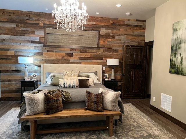27 Elk Meadow Ln, Kalispell, MT 59901 - bedroom with wooden walls, wood finished floors, baseboards, a chandelier, and an accent wall