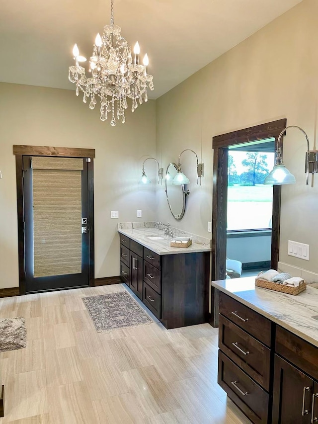 27 Elk Meadow Ln, Kalispell, MT 59901 - bathroom with vanity, a chandelier, and baseboards