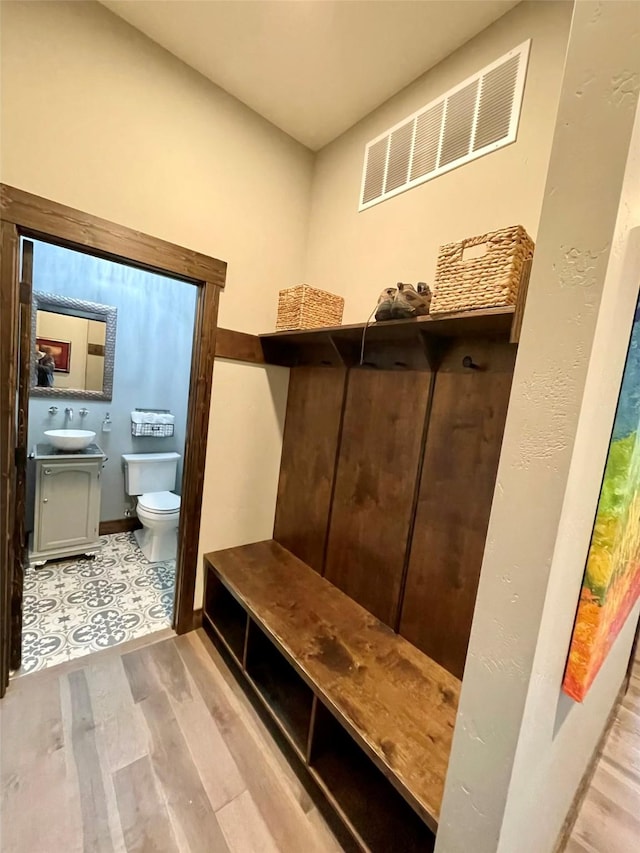27 Elk Meadow Ln, Kalispell, MT 59901 - mudroom with wood finished floors and a sink