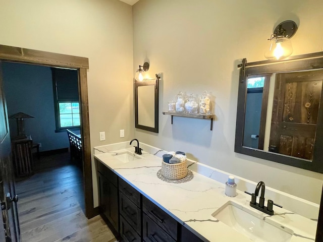 27 Elk Meadow Ln, Kalispell, MT 59901 - bathroom featuring wood finished floors and double vanity