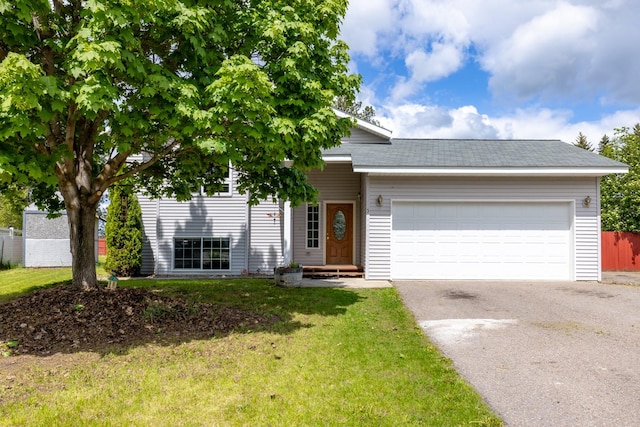 5 Darlene Rd, Columbia Falls, MT 59912 - view of front of house with asphalt driveway and an attached garage
