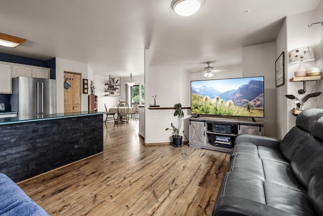 5 Darlene Rd, Columbia Falls, MT 59912 - living room with wood finished floors, a ceiling fan, and baseboards
