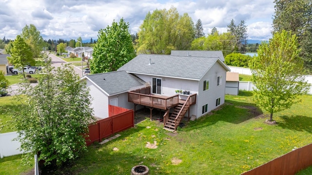 5 Darlene Rd, Columbia Falls, MT 59912 - back of house with a deck, stairs, and a shingled roof