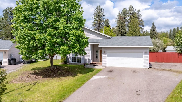 5 Darlene Rd, Columbia Falls, MT 59912 - view of front of house featuring driveway and a garage