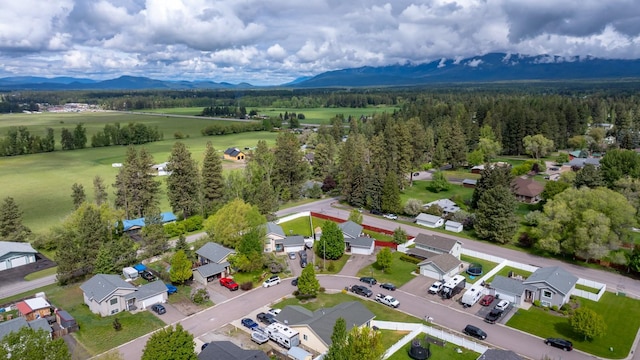5 Darlene Rd, Columbia Falls, MT 59912 - aerial perspective of suburban area with mountains and a heavily wooded area