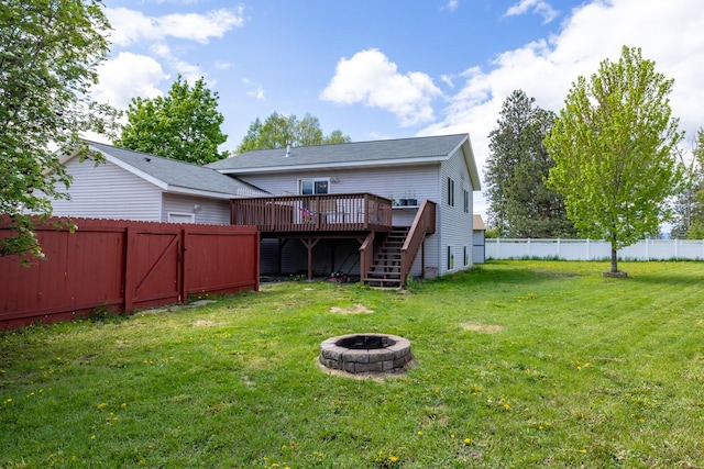 5 Darlene Rd, Columbia Falls, MT 59912 - back of house with a wooden deck, stairway, and a fire pit