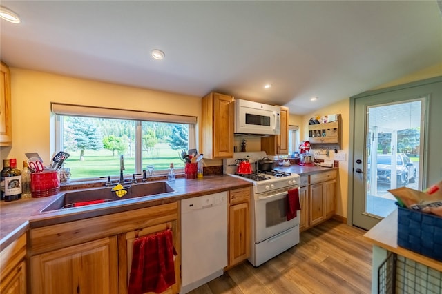 11537 Mt Highway 37 N, Libby, MT 59923 - kitchen featuring white appliances, a sink, light wood-style floors, vaulted ceiling, and recessed lighting