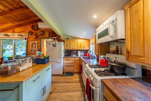 11537 Mt Highway 37 N, Libby, MT 59923 - kitchen with butcher block countertops, white appliances, a sink, light wood-style floors, and backsplash