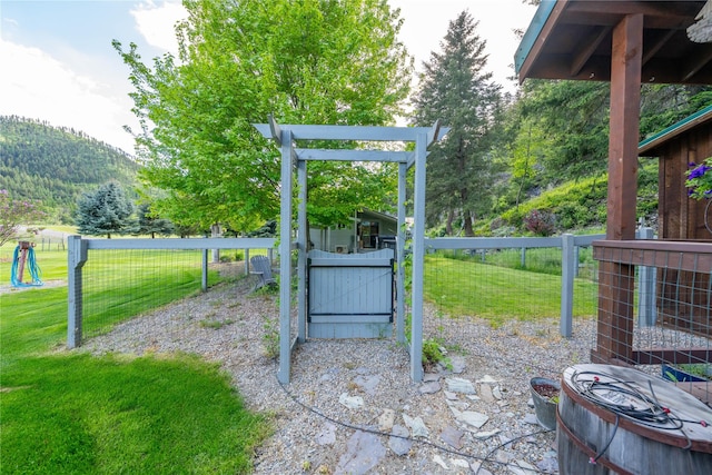 11537 Mt Highway 37 N, Libby, MT 59923 - view of patio / terrace featuring a gate and a mountain view