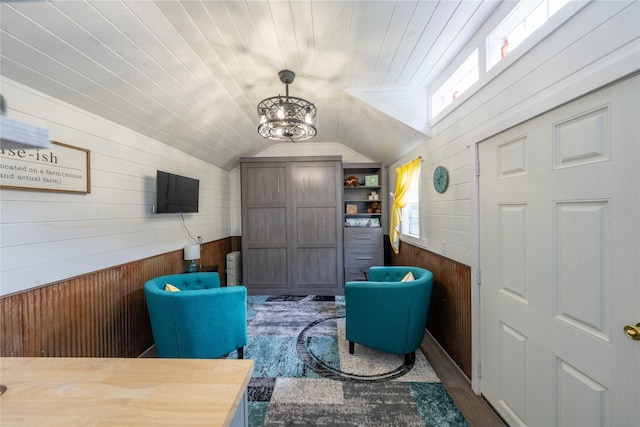 11537 Mt Highway 37 N, Libby, MT 59923 - sitting room featuring wood walls, vaulted ceiling, a chandelier, and dark wood-style flooring