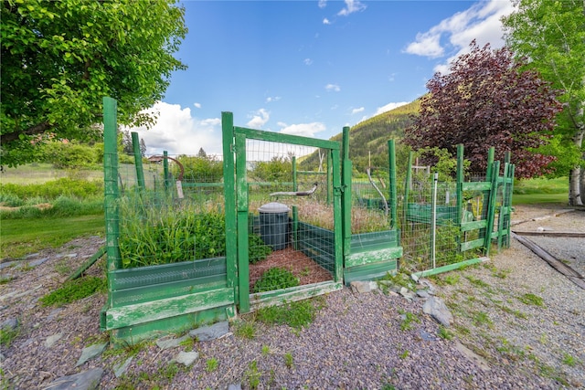 11537 Mt Highway 37 N, Libby, MT 59923 - gate with a vegetable garden and central AC unit