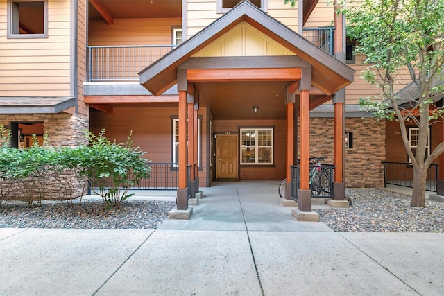 4100 Mullan Rd Unit 102, Missoula, MT 59808 - doorway to property featuring covered porch and stone siding