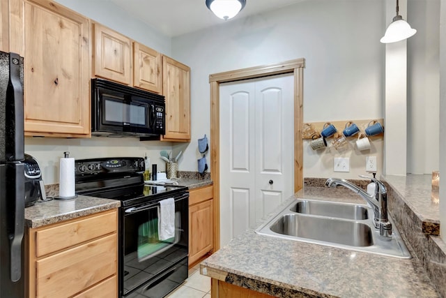 4100 Mullan Rd Unit 102, Missoula, MT 59808 - kitchen with black appliances, light brown cabinetry, a sink, and light tile patterned floors