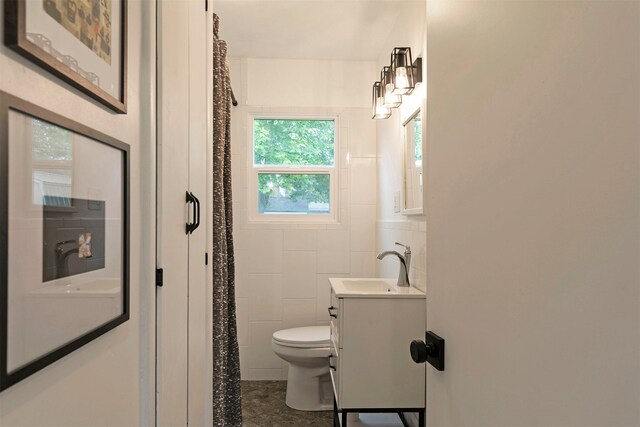 2929 Sunrise Promenade Promenade, Missoula, MT 59801 - bathroom with toilet, vanity, tile walls, and curtained shower