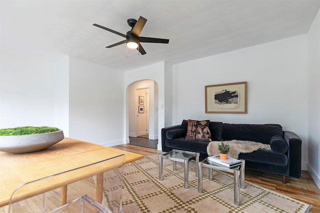 2929 Sunrise Promenade Promenade, Missoula, MT 59801 - living area with arched walkways, ceiling fan, and wood finished floors