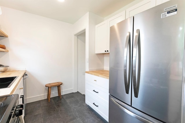 2929 Sunrise Promenade Promenade, Missoula, MT 59801 - kitchen with appliances with stainless steel finishes, open shelves, white cabinets, and baseboards