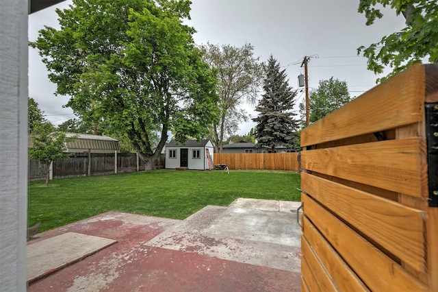 2929 Sunrise Promenade Promenade, Missoula, MT 59801 - fenced backyard featuring a patio area and an outdoor structure
