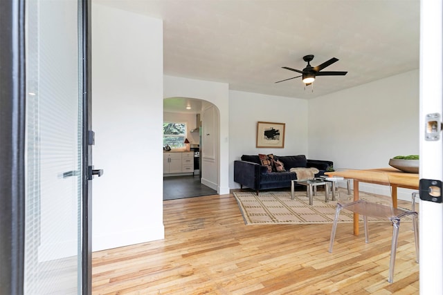 2929 Sunrise Promenade Promenade, Missoula, MT 59801 - living area with arched walkways, light wood-style flooring, and a ceiling fan