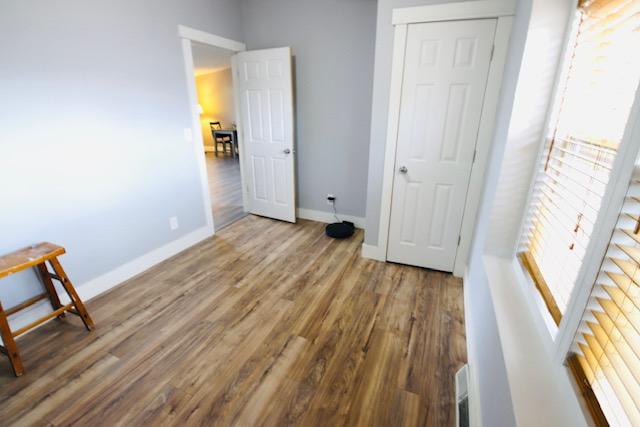 4757 Richlie, Missoula, MT 59808 - unfurnished bedroom featuring baseboards and wood finished floors