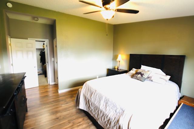 4757 Richlie, Missoula, MT 59808 - bedroom featuring wood finished floors, baseboards, and a ceiling fan