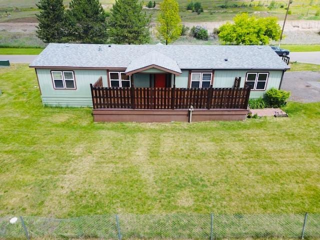 4757 Richlie, Missoula, MT 59808 - back of property featuring a lawn and a wooden deck